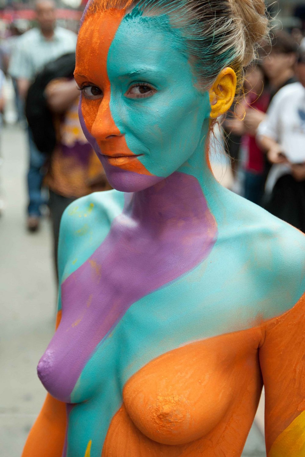 Nudist girls doing body paint in public #fclT5UMp